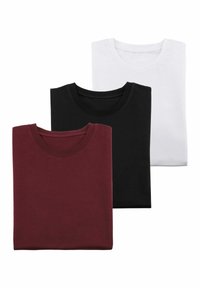 Three folded t-shirts in maroon, black, and white. Each features a crew neckline and is made of soft cotton material.