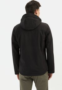 Zwarte hooded jacket met een gladde textuur en zichtbare naden, met een casual pasvorm en een geborduurd ontwerp op de achterkant.