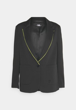 Black single-button blazer with neon yellow piping on lapels and front pockets, featuring Karl Lagerfeld logo on the lower pocket.
