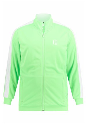 Giacca verde con zip e colletto alto, pannelli laterali bianchi e logo sul petto. Realizzata in tessuto liscio e leggero.