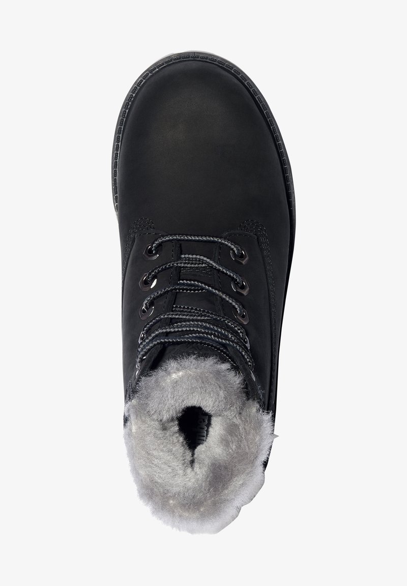 Black insulated boot with a rounded toe, soft gray fur lining, metallic eyelets, and black laces. Textured rubber sole for grip.
