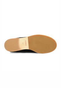Black suede shoe sole with a smooth, light brown rubber bottom. Features include embossed branding and size 37 markings on the insole.