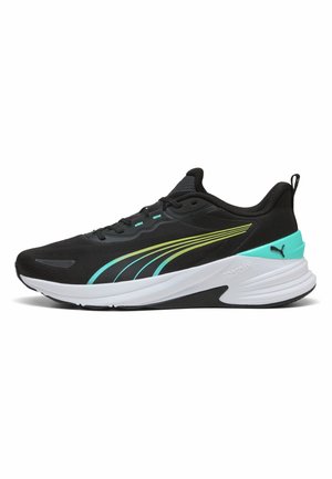 Scarpa sportiva nera con suola bianca, dettagli turchese e verde lime, e una linguetta al tallone, mostrata di profilo su sfondo bianco.