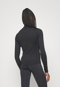 Ellesse SOFIRA 1/4 ZIP - Ilgarankovis viršutinės dalies drabužis - black