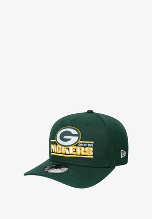 Green baseball cap made of fabric, featuring embroidered "Green Bay Packers" text in yellow and white, with a curved brim and adjustable strap.
