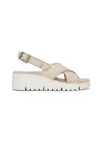 Beige wedge sandals with cross-straps, textured fabric, adjustable ankle strap, and thick white sole with ridged detailing.