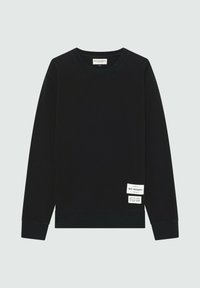 Felpa nera in cotone testurizzato con scollo rotondo, polsini a coste e un'etichetta con logo sul lato anteriore in basso a sinistra.