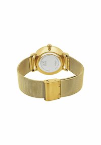Goldfarbene Edelstahl-Uhr mit einem Mesh-Armband, runden Gehäuse und minimalistischen Design. Enthält eine Schließe und einen sichtbaren Rücken mit Markeninformationen.