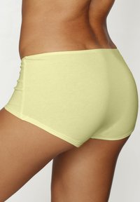 Lime green cotton blend hipster shorts with a smooth texture, featuring a mid-rise design and no visible hardware or patterns.