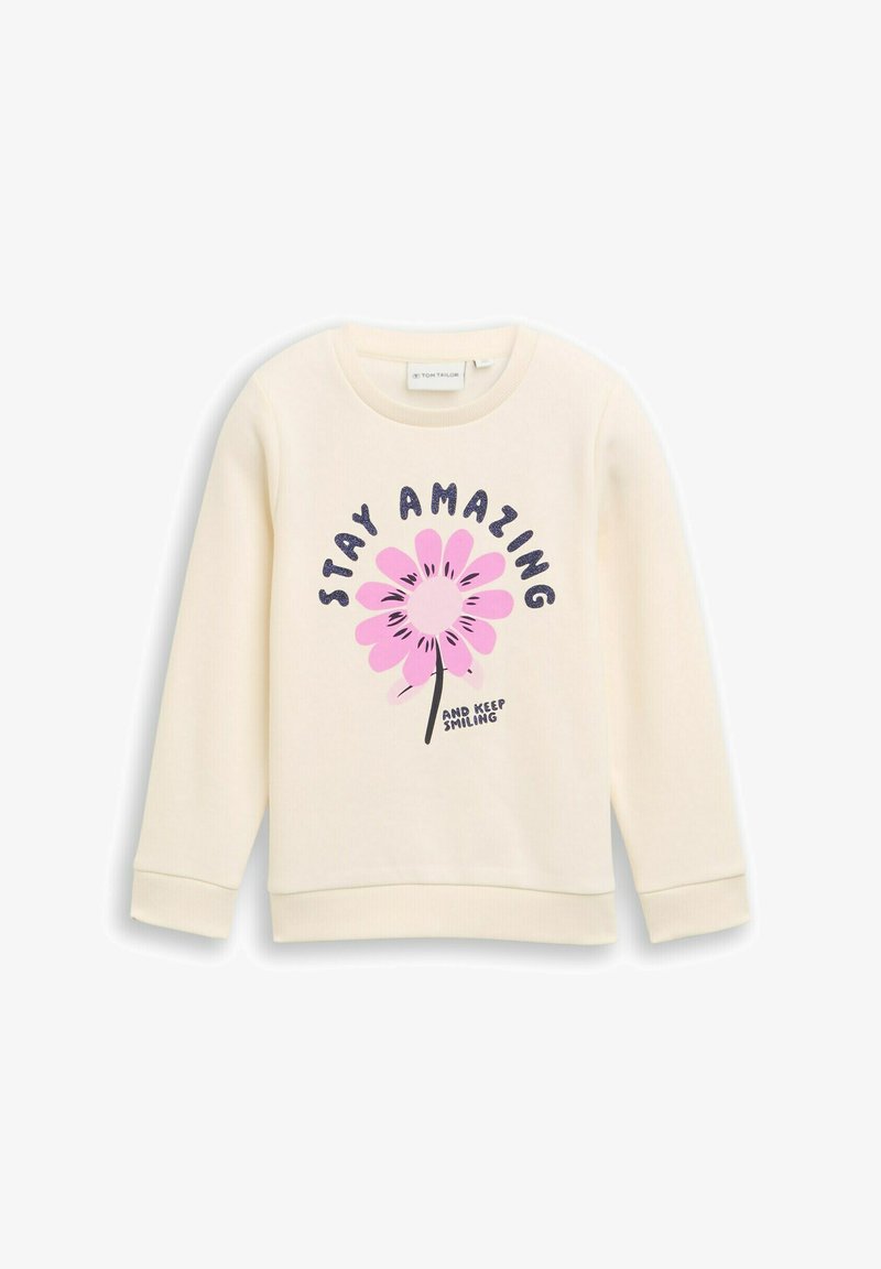 Krämfärgad sweatshirt med rund halsringning, som har en stor rosa blommig grafik och texten "STAY AMAZING" i mörkblått.