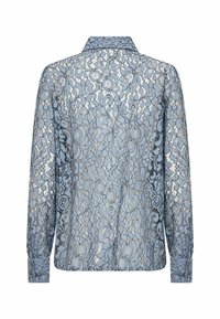 Blouse en dentelle bleu clair à manches longues avec motifs floraux et col, vue de dos sur fond blanc.