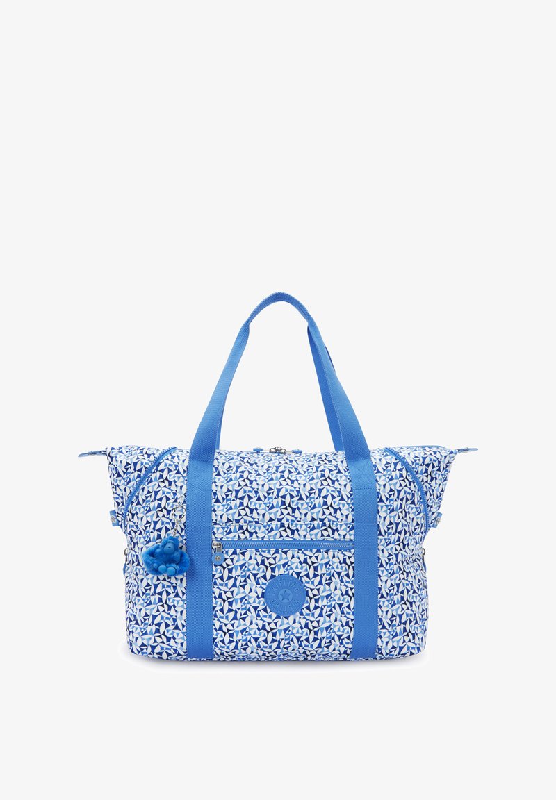Borsa tote blu e bianca con motivo, manici doppi, tasca frontale con zip e un piccolo portachiavi a forma di scimmietta blu in peluche attaccato.