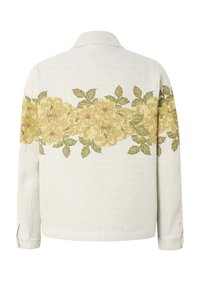 Chemise beige clair à manches longues avec une bande horizontale de fleurs jaunes et de feuilles vertes sur le dos et les manches.