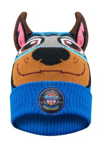 Berretto lavorato a maglia con un design di un cane animato, nei colori marrone, blu e nero, con orecchie decorative e una toppa del PAW Patrol.