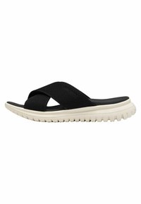 Melnas krustveida flip-flops ar teksturētu augšpusi, baltu �ārējo zoli un biezu rakstainu zoli, kas nodrošina saķeri un komfortu.