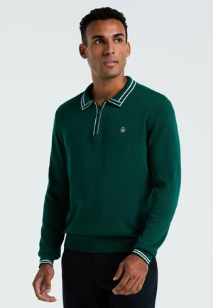 Groen gebreide pullover met een ritskraag, voorzien van contrasterende witte afwerking en een klein logo op de borst. Geribbelde manchetten en zoom.