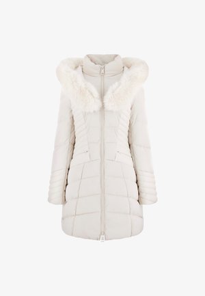 Helebeige puffer jope, millel on vale karusnaha kapuuts, vertikaalsed ja horisontaalsed tikandimustrid, eeslukuga sulgur ja küljetaskud.
