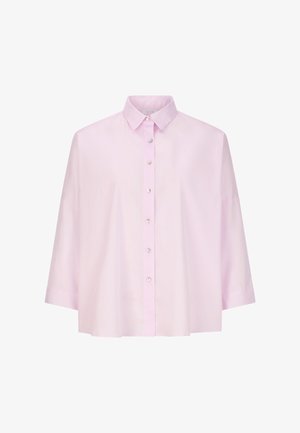 Világos rózsaszín, galléros ing, gombos elülső résszel, laza szabással és rövid ujjakkal, sima pamut anyagból készült.