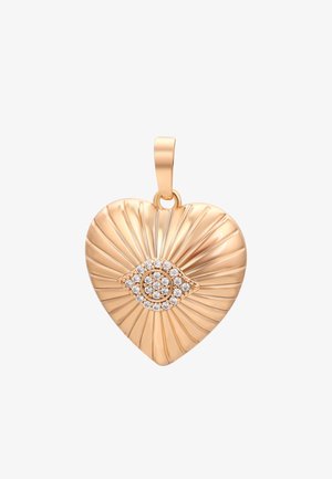 Gold heart-shaped pendant with ribbed texture, featuring a detailed eye design embellished with small clear gemstones in the center.