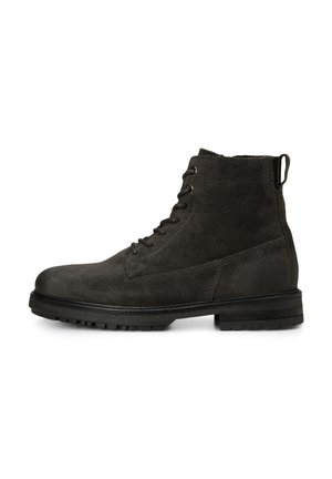 Schwarzer Veloursleder-Schnürstiefel mit Zuglasche hinten und dicker Gummisohle mit Profil für besseren Grip.