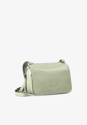 Light green leather crossbody bag with flap closure and adjustable strap, embossed with "aunts & uncles" logo on front.