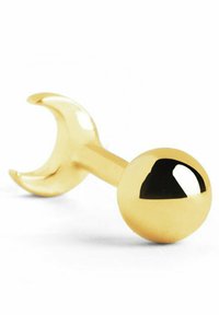 Accesorio metálico color dorado que presenta un extremo esférico y un mango en forma de media luna, con una superficie lisa y un acabado reflectante.