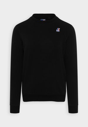 Sweat-shirt noir à col rond avec manches longues et petite étiquette avec le logo K-Way sur le côté gauche de la poitrine.