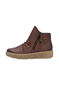Botas de tobillo de cuero marrón con un acabado texturizado, diseño holgado, cierre de cremallera lateral y una suela de goma marrón con patrones de rejilla.