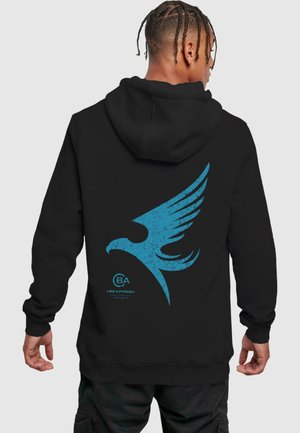 Black hoodie featuring a large blue eagle graphic and text on the back. Made of soft material with a drawstring hood and ribbed cuffs.