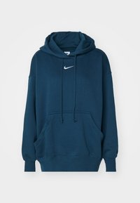 Sudadera de Nike de color azul oscuro con bolsillo frontal, cordones y logo en forma de swoosh blanco centrado debajo del cuello.