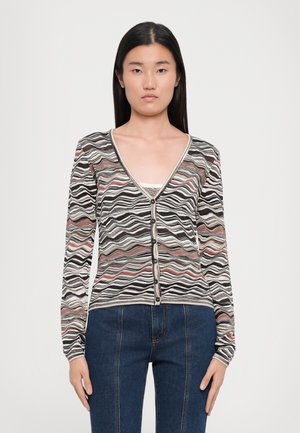 Striped cardigan with a V-neck, black, white, and pastel wave patterns. Features long sleeves and black buttons along the front.