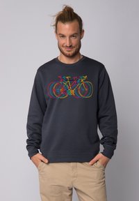 Donkerblauw sweatshirt met een multikleurige fietsafbeelding. De stof lijkt zacht en heeft ribgebreide manchetten en een zoom, wat het comfort en de pasvorm verbeterd.