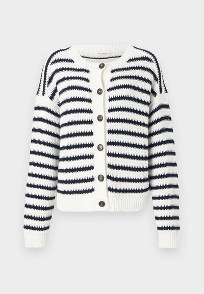 Kootud kardigan, millel on horisontaalsed tumesinised ja valged triibud, ümmargune kaelus, nööpide sulgemine ning soonikused varrukaotsad ja alumine äär.