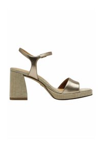 Sandal metallico oro con punta chiusa, cinturino alla caviglia regolabile e tacco a blocco testurizzato. La soletta è liscia e leggermente imbottita.