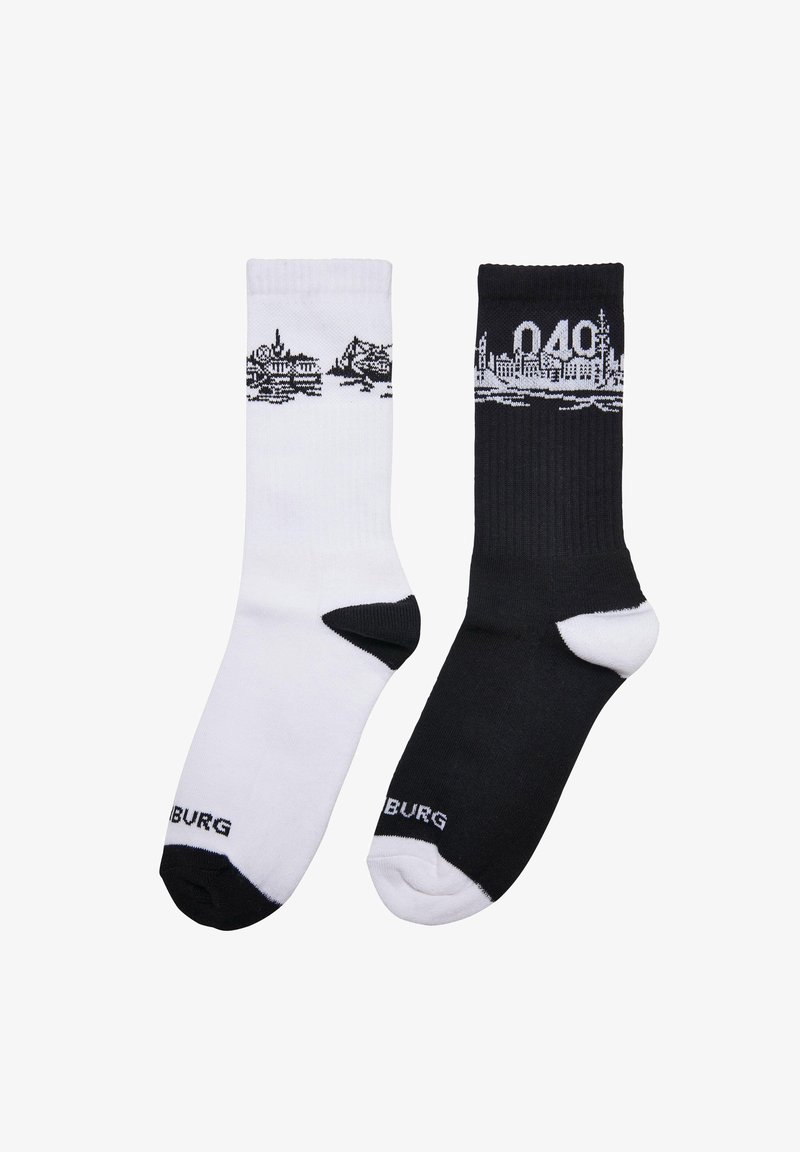 Mustvalged mustad ja valged sokid, millel on linnasiluetti graafika. Materjaliks on puuvilla segu. Kontrastse kanna ja varba aktsendid. Brändi nimi on välja toodud.