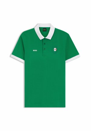 Green polo shirt with white collar and sleeve cuffs, three buttons, "BOSS" text on left chest, and a small Mexican flag shield on right chest.
