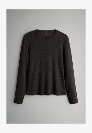 Pitkähihaista tumma ruskeaa kangasta, jossa on hillitty leopardikuosis. Ominaisuuksiin kuuluu pyöreä pääntie ja rento malli suoran helman kanssa.