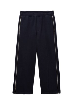 Pantalon large bleu marine foncé avec taille élastique et fines bandes blanches latérales sur chaque jambe, posé à plat sur un fond blanc.