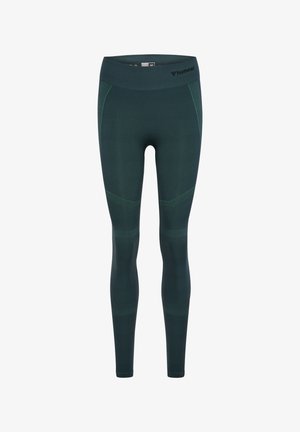 Donkergroene naadloze sportleggings met getextureerde panelen, een hoge tailleband en een klein zwart Hummel-logo aan de rechterkant van de taille.