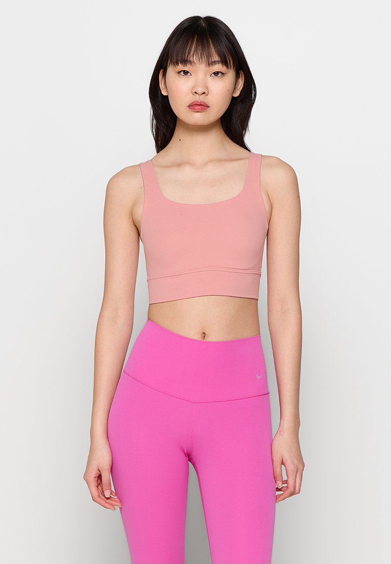 Nike Performance Sport-bh met medium support zalmroze
