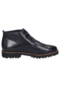 Bottines en cuir de couleur bleu marine foncé. Elles possèdent un bout rond, un design de laçage simple et une semelle en caoutchouc robuste avec un motif de texture.