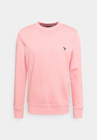 Rosa sweatshirt i mjukt tyg, med rund halsringning, långa ärmar och en liten flerfärgad hästlogga på bröstet.