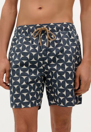 Pantaloni scurți de înot navy, cu un model geometric în crem, confecționați dintr-un material ușor. Talie elastică cu detalii de cordon.