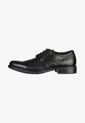 Zwarte leren dresschoenen met een gladde textuur, een klassieke ronde neus en een vetersluiting. Heeft een lage, gestapelde hak en minimalistische accenten.