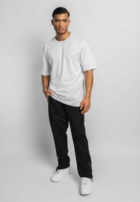Dropsize WIDE - Tracksuit bottoms - black
