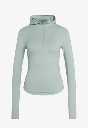 Hoodie de sport à manches longues bleu clair avec demi-fermeture éclair à l'avant et petit logo circulaire sur le côté gauche de la poitrine.