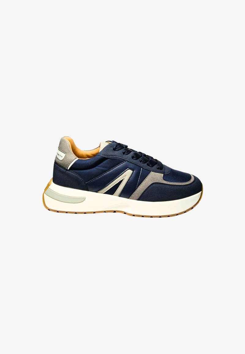Navyblaue Sneaker mit Obermaterial aus Leder und Wildleder, grauen Akzenten und einer dicken weißen Zwischensohle. Verfügt über runde Schnürsenkel und ein gepolstertes Innenfutter.