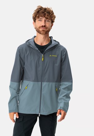 Veste imperméable Vaude grise avec des accents gris clair. Elle comprend une capuche, une fermeture éclair à l'avant et des zips contrastants jaunes. Material léger.
