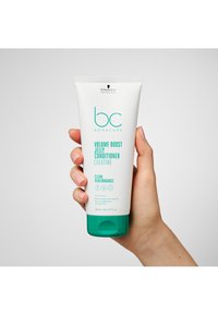 Tube de revitalisant gelée volume BC Bonacure, blanc avec des accents turquoise, avec un bouchon rabattable, étiqueté pour cheveux fins, 200 mL.