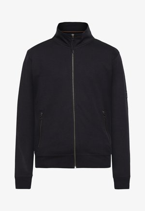 Sort zip-jakke med høj krave, to sidelommer med lynlås og ribbede manchetter. Glat tekstur med et moderne, minimalistisk design.